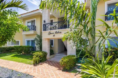 a building with a sign that reads guest house at Private & Luxury Apartment Cocotal in Gated & Secured Community in Punta Cana