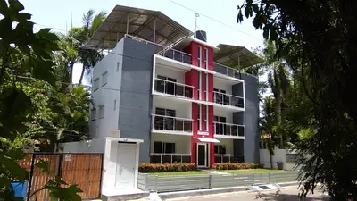 a building with red shutters on it at SolyViento 67 in Cabarete