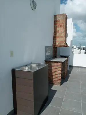 a kitchen with a sink on top of a building at Cozy apartment in exclusive area Bella Vista in Santo Domingo