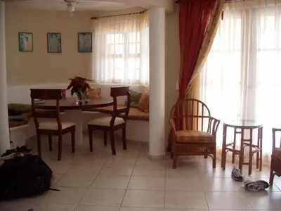 a dining room with a table and chairs at 3br Villa with Vip Access - All Inclusive Program with Alcohol Included in San Felipe de Puerto Plata