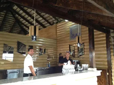 a man and a woman standing at a bar at Junior Suite in Puerto Plata at Lifestyle Holidays Vacation Club in San Felipe de Puerto Plata