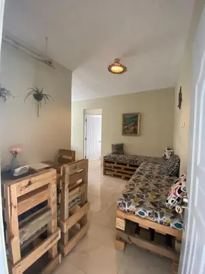 a bedroom with a bed and a table at Villa Coconut in La Verita