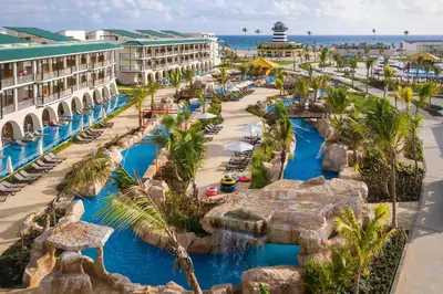 an aerial view of a resort with a water park at Ocean el Faro Resort - All Inclusive in Punta Cana