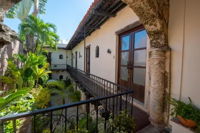 an external view of a house with a balcony at El Beaterio Casa Museo in Santo Domingo