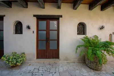 a front door of a house with plants at El Beaterio Casa Museo in Santo Domingo