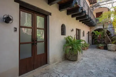an entrance to a house with a wooden door at El Beaterio Casa Museo in Santo Domingo