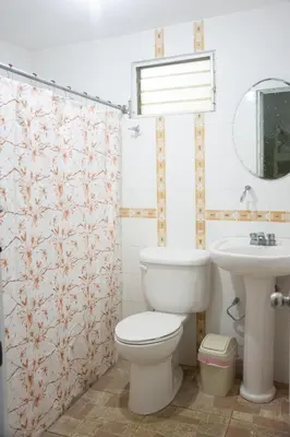 a bathroom with a toilet and a sink at Hotel Santo Cerro Natural Park in Santo Cerro