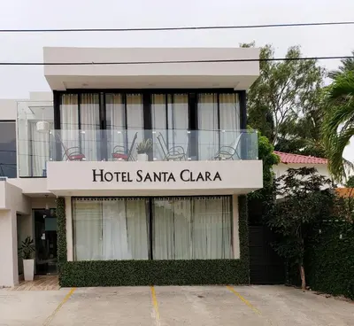 a hotel santa clarita clara sign on a building at Hotel Santa Clara in San Fernando de Monte Cristi