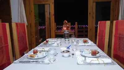 a table with plates of food on it at Mi Hogar Jarabacoa in Jarabacoa