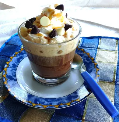 a cup of chocolate ice cream with chocolate chips and whipped cream at Mi Hogar Jarabacoa in Jarabacoa