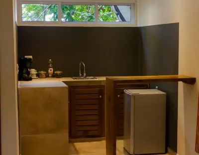 a small kitchen with a sink and a sink at Afreeka Beach Hotel in Las Terrenas