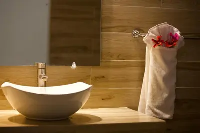 a bowl sink in a bathroom with a towel at Afreeka Beach Hotel in Las Terrenas