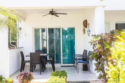 a patio with chairs and a table on a house at Las Terrenas, La Fenice, Playa Popy in Las Terrenas