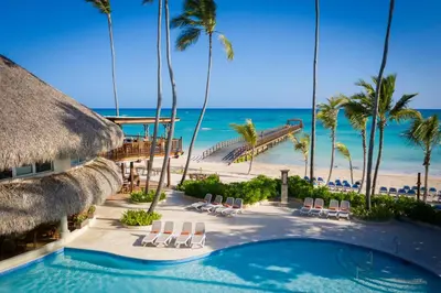 a resort with a swimming pool and a beach at Impressive Punta Cana - All Inclusive in Punta Cana