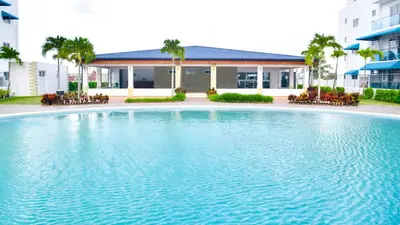a large swimming pool in front of a building at Dolce Villas at Harmony 2 in Santiago de los Caballeros