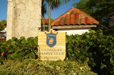 a sign for a family club in front of a building at Pez 106 in Bayahibe