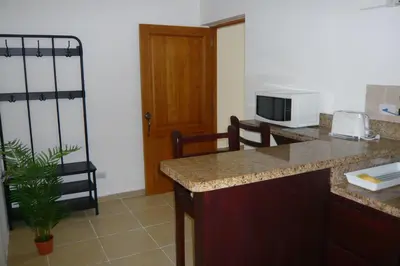 a kitchen with a counter top and a microwave at Pez 106 in Bayahibe