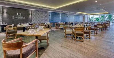 a dining room with tables and chairs in a restaurant at Senator Puerto Plata in San Felipe de Puerto Plata
