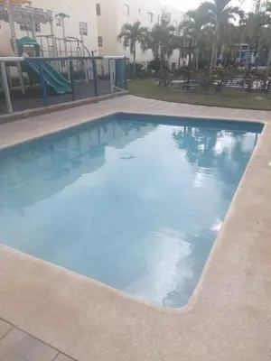 a swimming pool in a resort with a playground at PARADISE 3 Cerro Altos in Santiago de los Caballeros