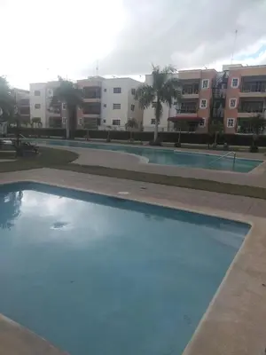 an empty swimming pool with buildings in the background at PARADISE 3 Cerro Altos in Santiago de los Caballeros