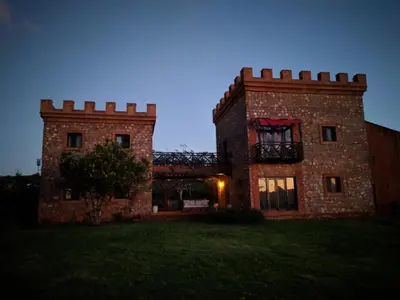 a large brick building with a window on it at El Castillo in Las Galeras