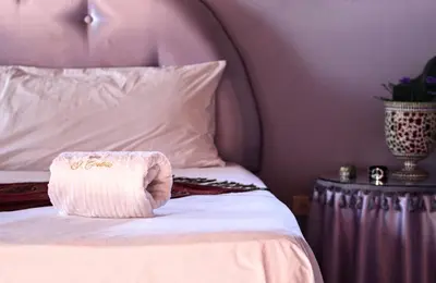 a close up of a bed with a pillow on it at El Castillo in Las Galeras