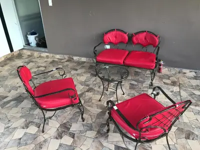 four red chairs and a table in a room at Aprtamento Deluxe Santiago, Residencial Palma Real R402 in Santiago de los Caballeros