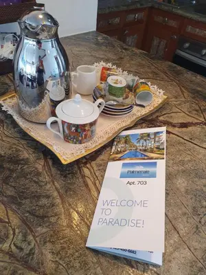 a table with a welcome to parakeet sign on it at Palmeraie Terrenas Beach Apartment in Las Terrenas