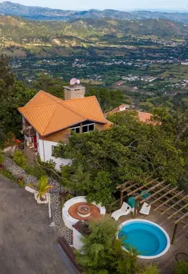 an aerial view of a house with a swimming pool at Mansion Dubai-Mountain-Jacuzzi-4BR-Jamaca De Dios in Jarabacoa
