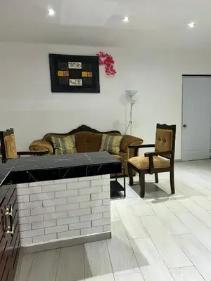 a living room with a couch and a table and chairs at Villa Kate in Las Terrenas