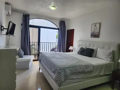 a bedroom with a bed and a large window at Million View Room Adults Only Resort 3 in La Laguna