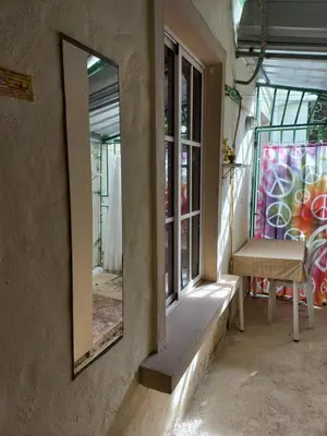 a mirror on the side of a room with a window at MiniHabitacion coqueta in Santo Domingo