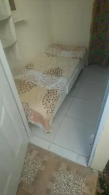 a small bed sitting on the floor in a room at MiniHabitacion coqueta in Santo Domingo