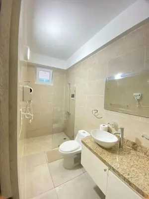 a bathroom with a toilet and a sink and a shower at Hotel Checkin El Cortecito Beach in Punta Cana