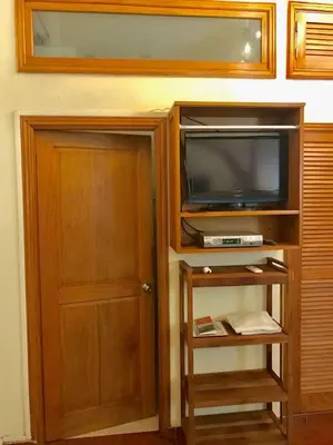 a door to a room with a tv and a door at Paseo Colonial - El Monasterio #4 in Santo Domingo