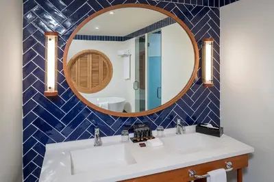 a bathroom with a sink and a mirror at El Beso Adults Only At Ocean El Faro - All Inclusive in Punta Cana