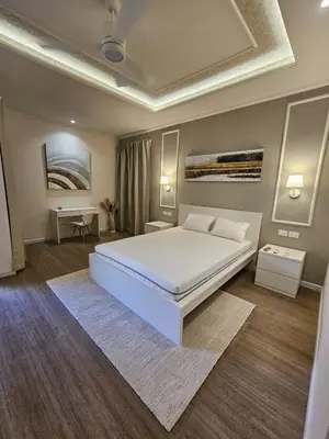 a bedroom with a large white bed in a room at Soficu Hotel El Edén Dominicus in Bayahibe