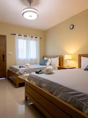 a bedroom with two beds and a window at Soficu Hotel El Edén Dominicus in Bayahibe