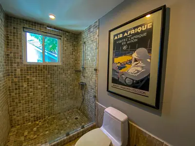 a bathroom with a picture of a shower and a toilet at Xeliter Balcones del Atlantico - Las Terrenas in Las Terrenas