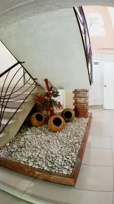 a room with a pile of rocks and a bed at Hotel Frano Romana Center in La Romana