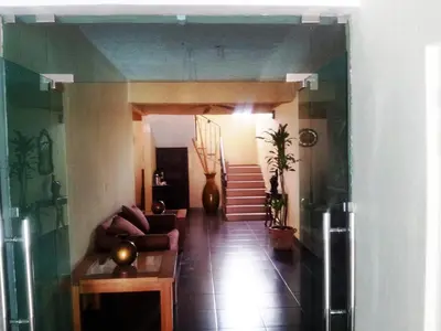 a view of a living room with a couch and stairs at Hotel Boutique River View La Romana in La Romana