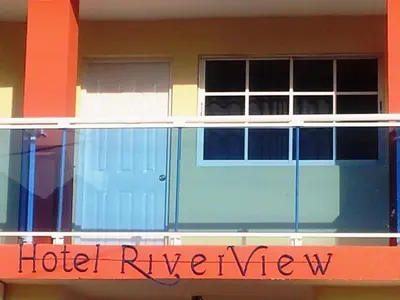 a close up of a hotel review sign on a building at Hotel Boutique River View La Romana in La Romana