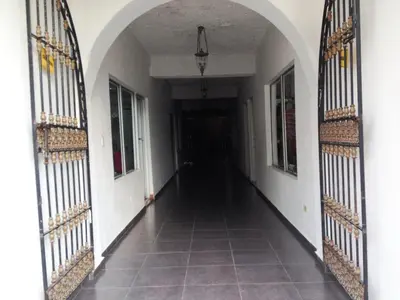 an empty hallway of a building with iron gates at Hotel Boutique River View La Romana in La Romana