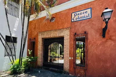 an orange building with a sign that reads passage colonial at Paseo Colonial - Sanctuary #2 in Santo Domingo
