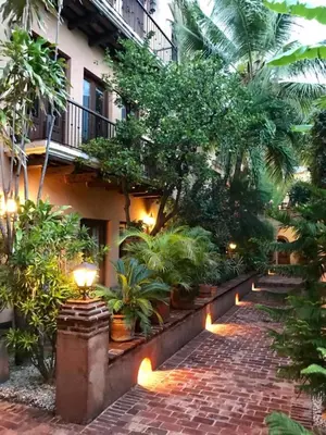 a courtyard of a building with plants and lights at Paseo Colonial - Leo's Favorite #8 in Santo Domingo