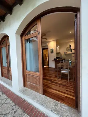 an entrance to a house with a wooden door at Paseo Colonial - Leo's Favorite #8 in Santo Domingo