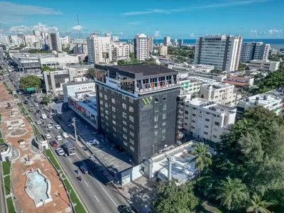 an overhead view of a city with a tall building at Weston Suites Hotel in Santo Domingo