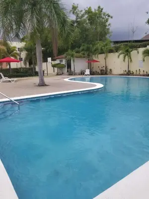 a large swimming pool with blue water at SANTIAGO CITY in Santiago de los Caballeros