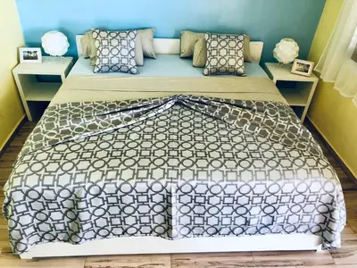 a bedroom with a large bed in a room at Casa Azul Las Galeras in Las Galeras
