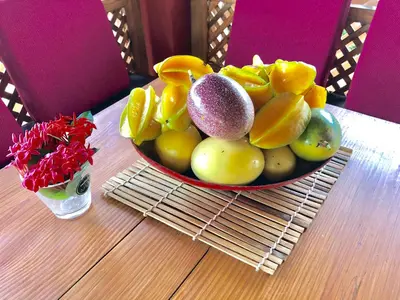 a bowl of fruit sitting on a table at Casa Azul Las Galeras in Las Galeras